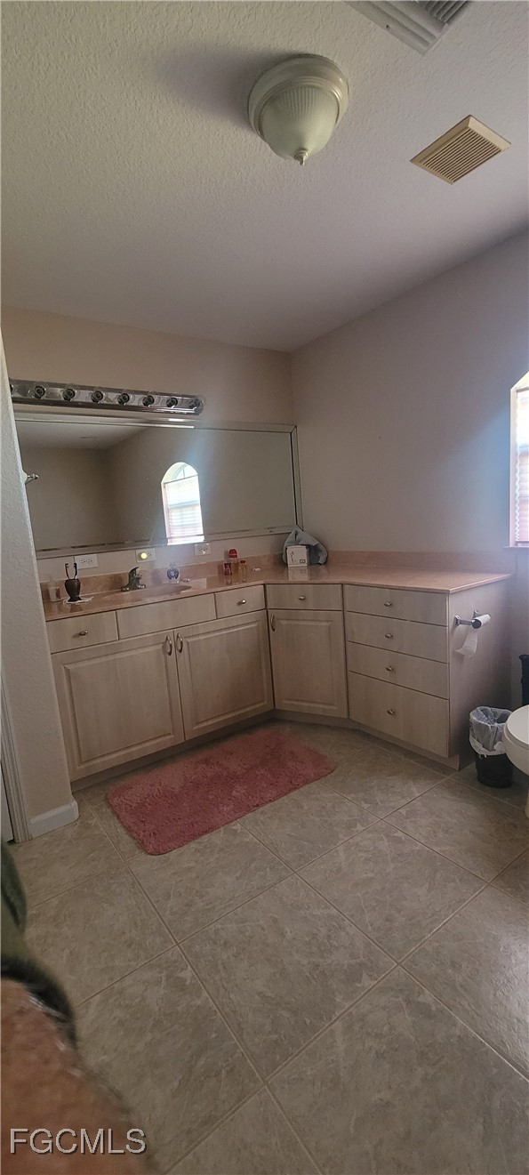 126-128 Tangerine Road Lake Placid, FL 33852 - Photo 14 of 29 a kitchen with kitchen island a stove a sink and a refrigerator