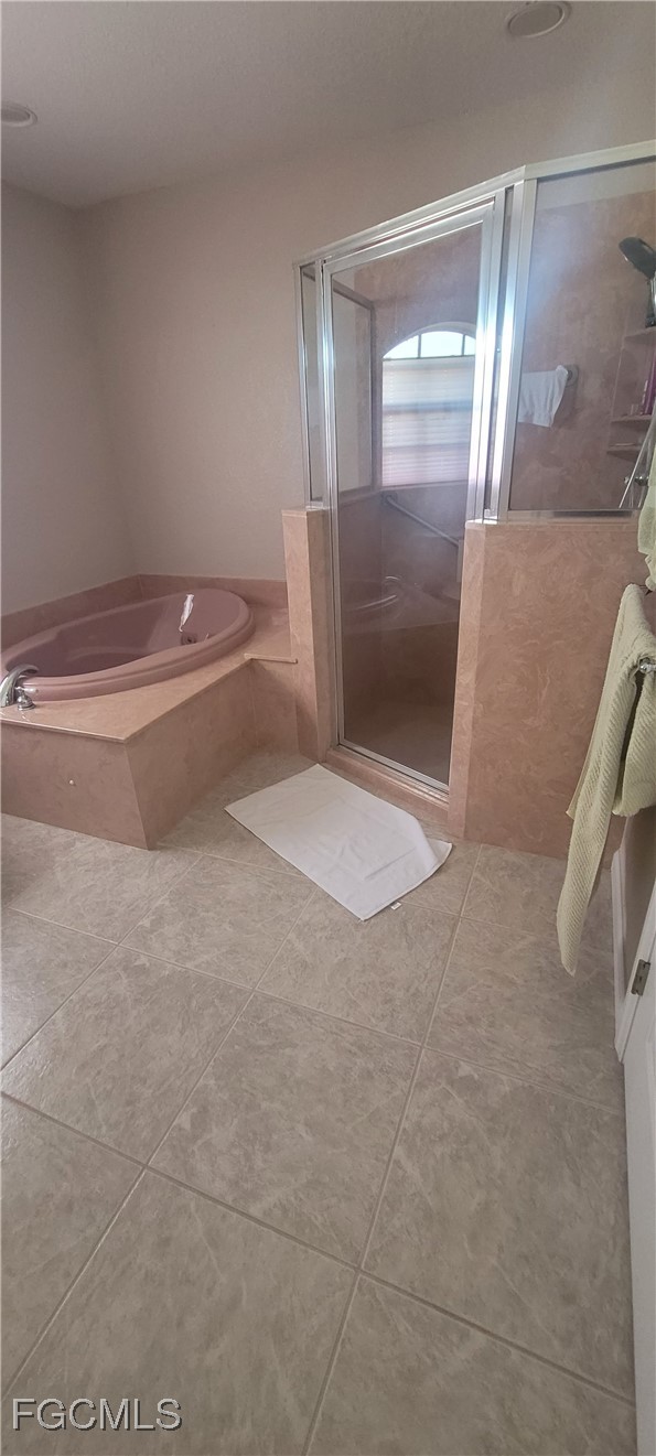 126-128 Tangerine Road Lake Placid, FL 33852 - Photo 15 of 29 a bathroom with a granite countertop toilet and a glass door shower