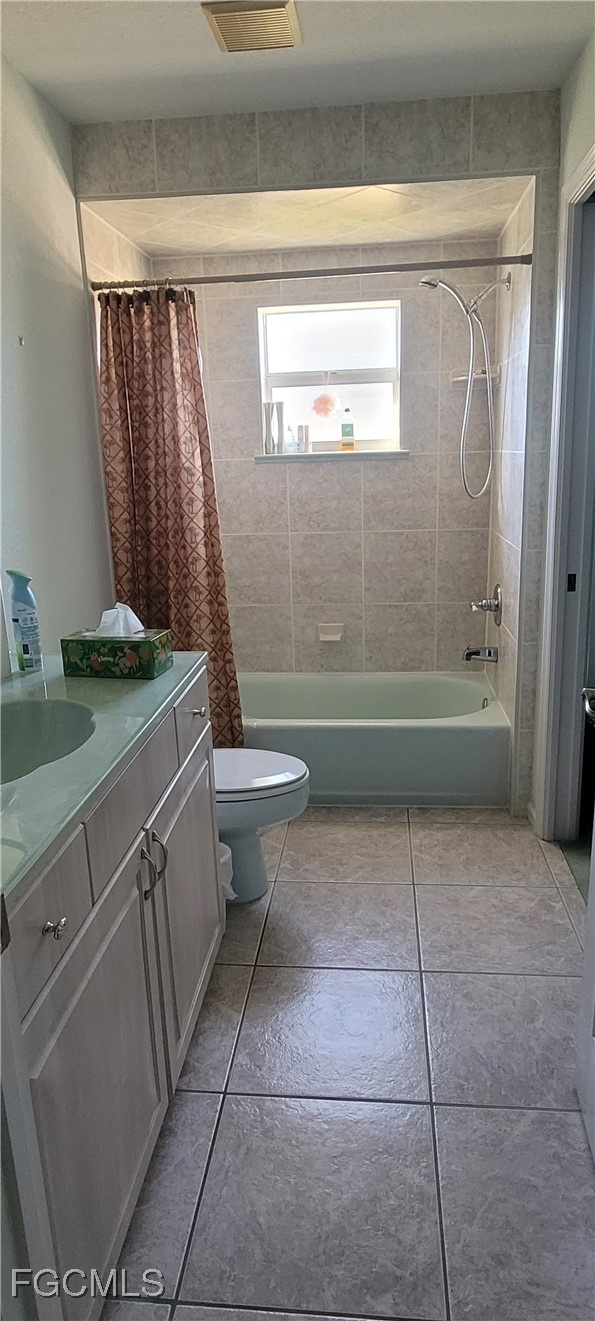 126-128 Tangerine Road Lake Placid, FL 33852 - Photo 22 of 29 a bathroom with a granite countertop sink a toilet and bathtub