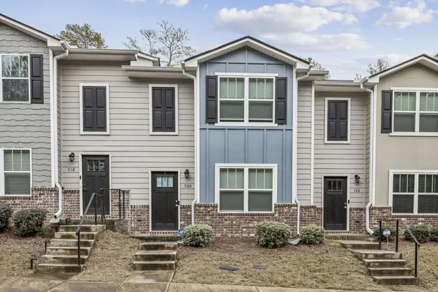 a front view of a house with garden