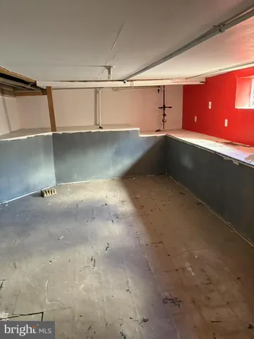 a kitchen with granite countertop a sink stove and cabinets