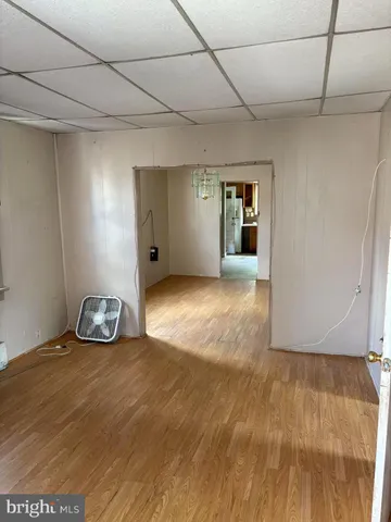 a white toilet sitting next to a shower curtain