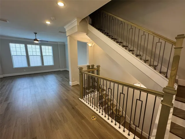 a kitchen with stainless steel appliances kitchen island granite countertop a stove and a refrigerator