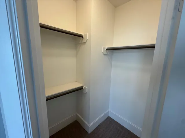 a bathroom with a tub a toilet and a shower