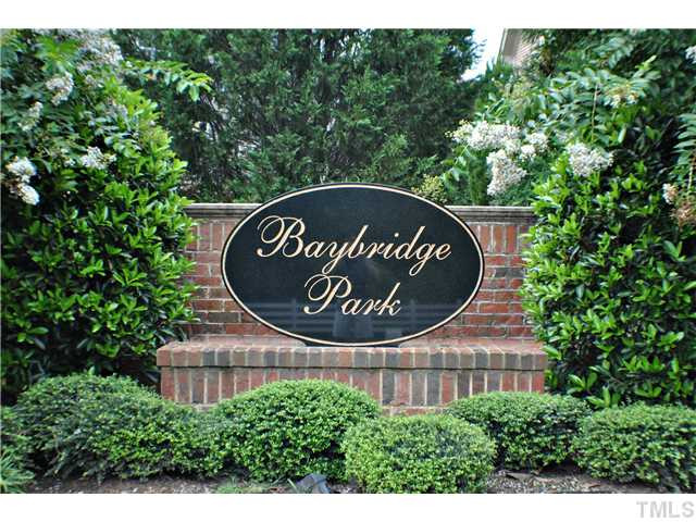 8505 Wynhurst Court, Unit 15 Raleigh, NC 27613 - Photo 25 of 25 a sign that is sitting on a wooden bench in a yard
