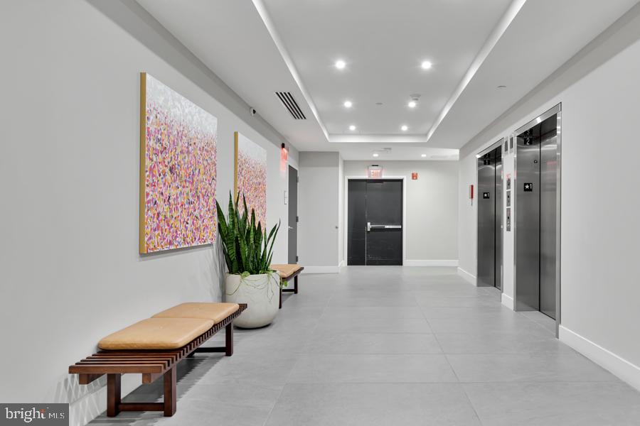 37 L Street Southeast, Unit 902 Washington, DC 20003 - Photo 24 of 43 a lobby with furniture and potted plant