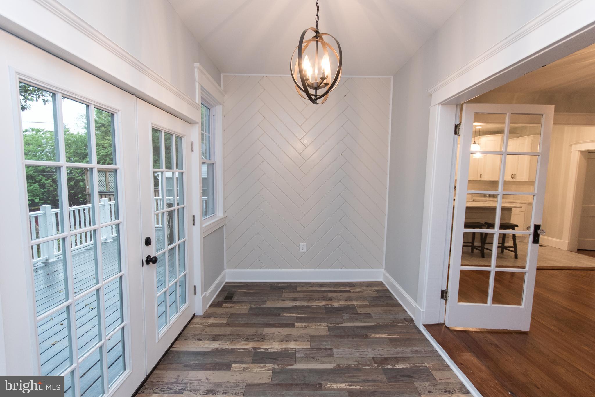 511 Dunkirk Road Baltimore, MD 21212 - Photo 11 of 27 a view of a room with wooden floor and windows