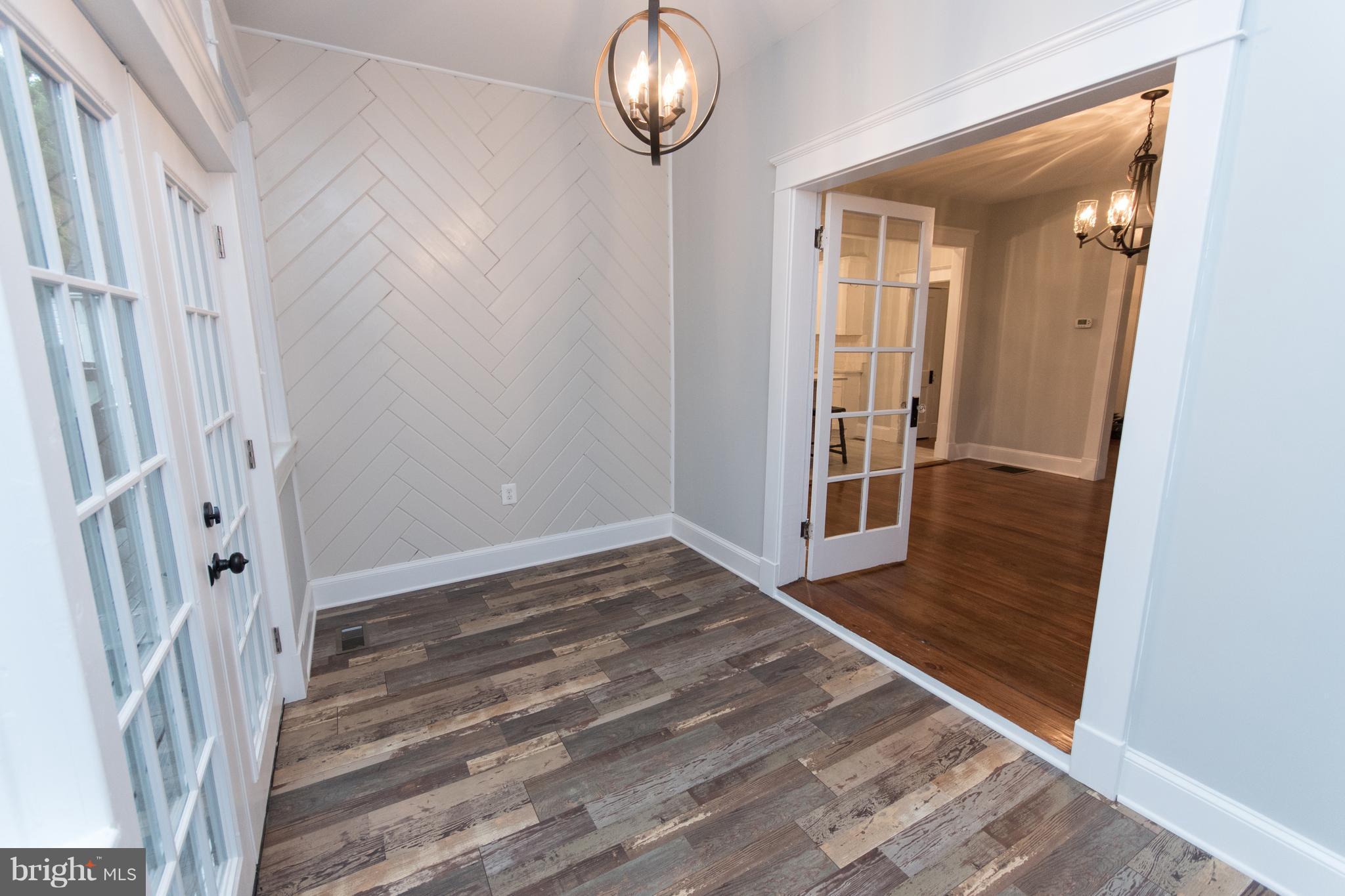 511 Dunkirk Road Baltimore, MD 21212 - Photo 12 of 27 a view of a room with wooden floor and staircase