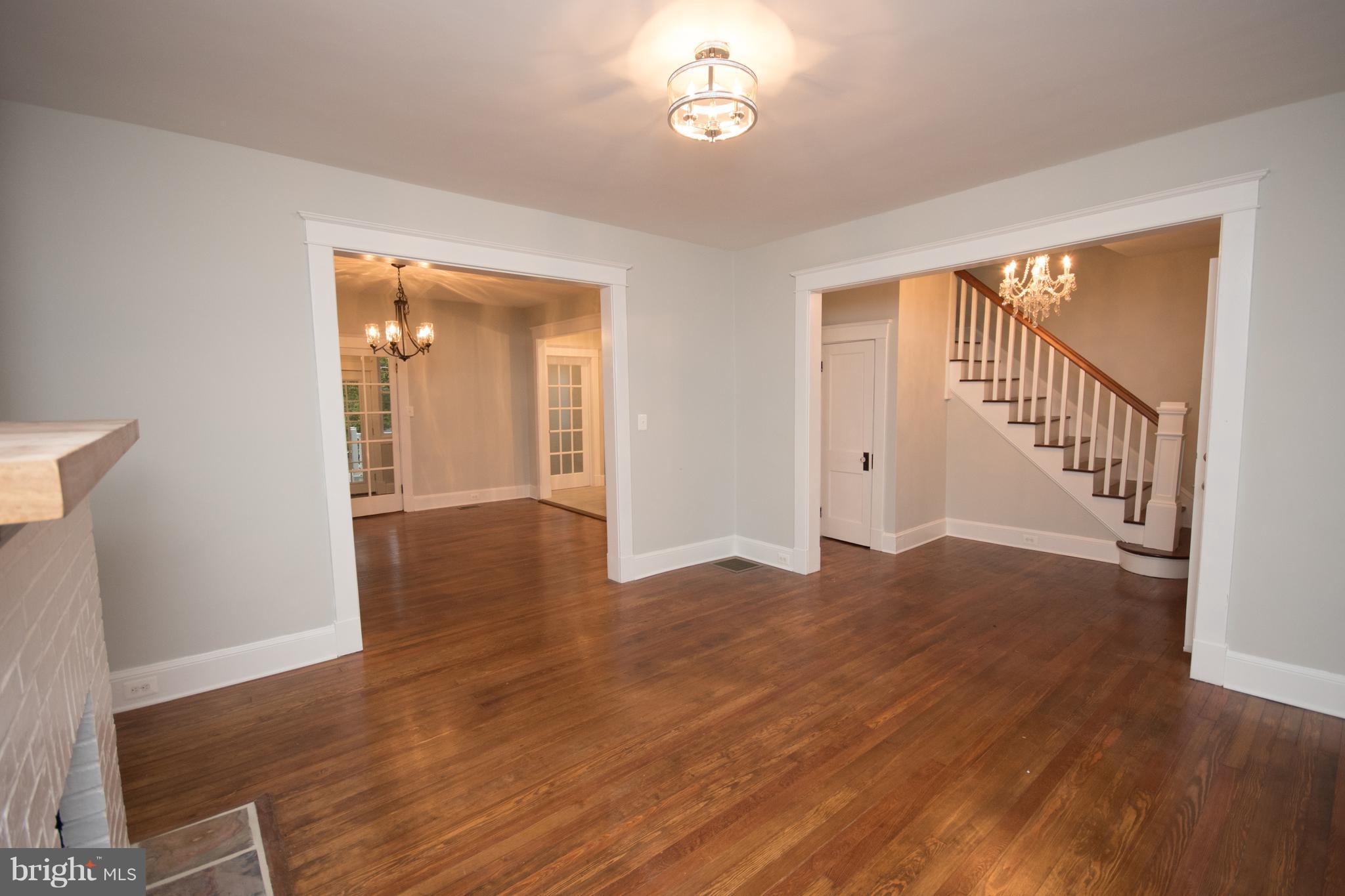 511 Dunkirk Road Baltimore, MD 21212 - Photo 3 of 27 wooden floor in an empty room with a window