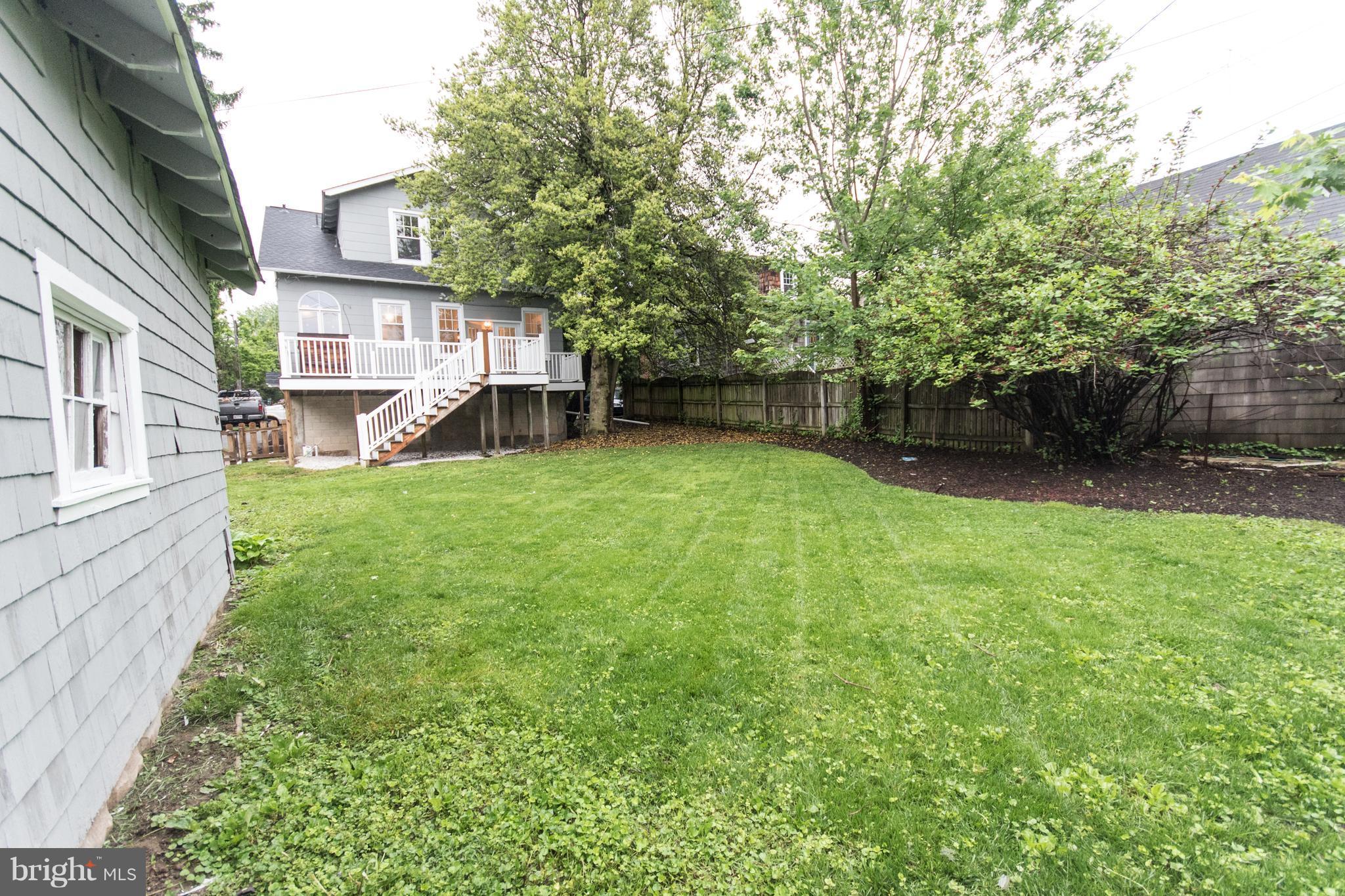 511 Dunkirk Road Baltimore, MD 21212 - Photo 25 of 27 a view of a yard with a house and a large tree