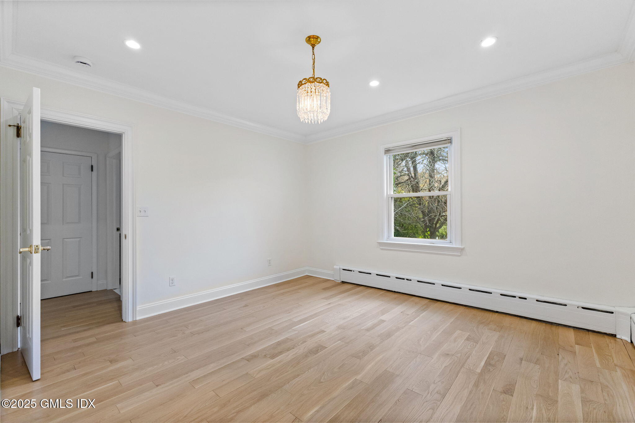 11 Gregory Road Cos Cob, CT 06807 - Photo 11 of 18 an empty room with wooden floor and windows