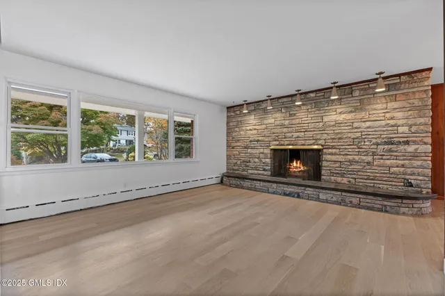 an empty room with fireplace