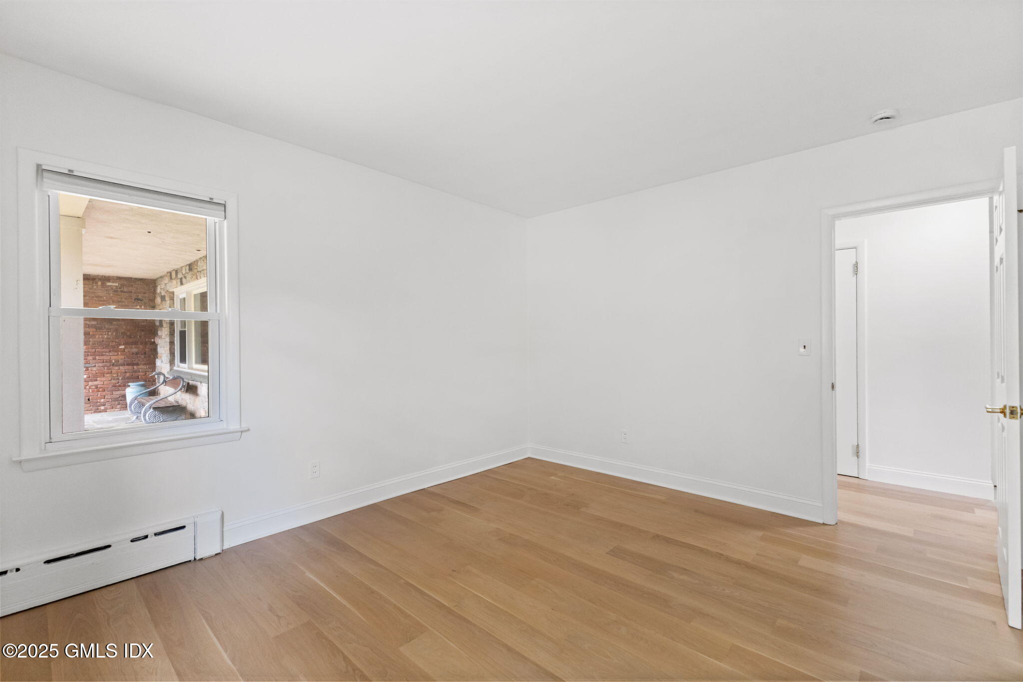 11 Gregory Road Cos Cob, CT 06807 - Photo 10 of 18 an empty room with a window