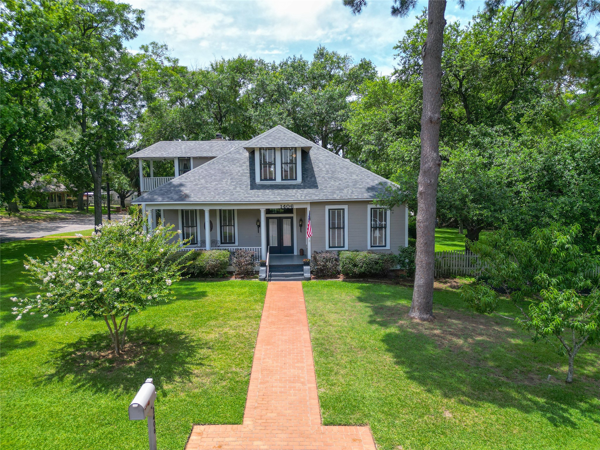 Discover timeless Southern elegance in this charming home located in the heart of the Brenham Historic District.