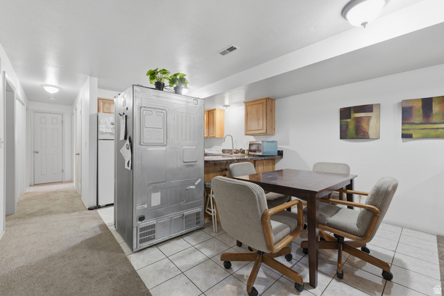 1700 Hickory Lane Provo, UT 84604 - Photo 11 of 20 Kitchenette featuring wood cabinetry, dark countertop, and tile flooring