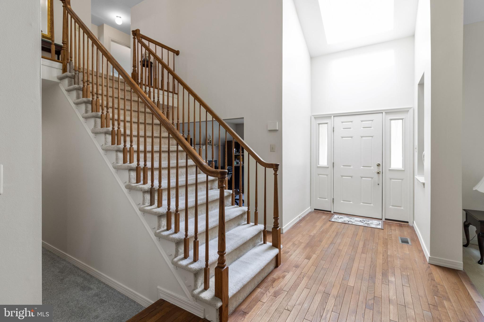 300 Windy Run Road Doylestown, PA 18901 - Photo 5 of 52 Foyer with hardwood floors & Skylight