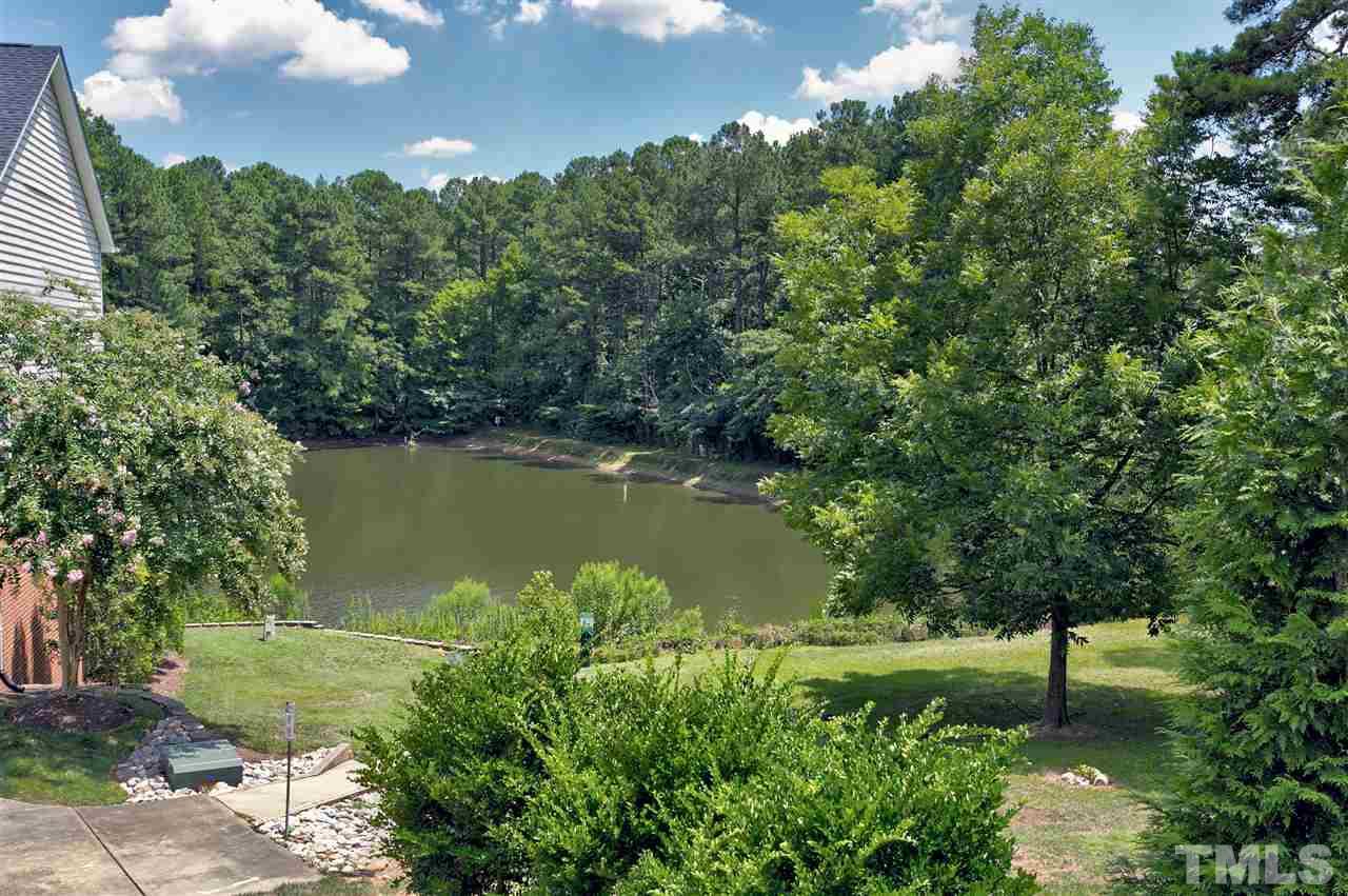 7206 Doverton Court Raleigh, NC 27615 - Photo 21 of 23 a view of a garden with a lake