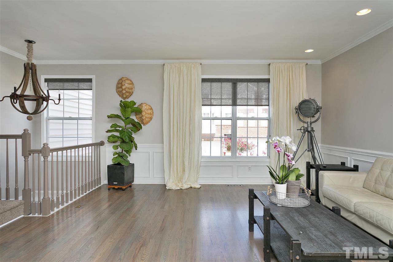 7206 Doverton Court Raleigh, NC 27615 - Photo 4 of 23 a living room with furniture and a window