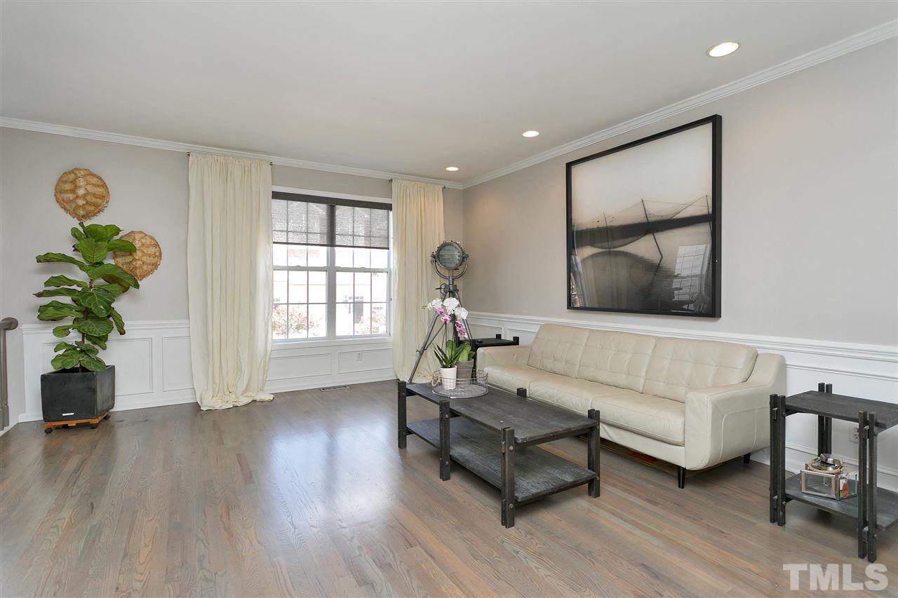 7206 Doverton Court Raleigh, NC 27615 - Photo 6 of 23 a living room with furniture and a wooden floor