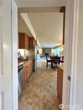 a kitchen with stainless steel appliances granite countertop a refrigerator and a stove