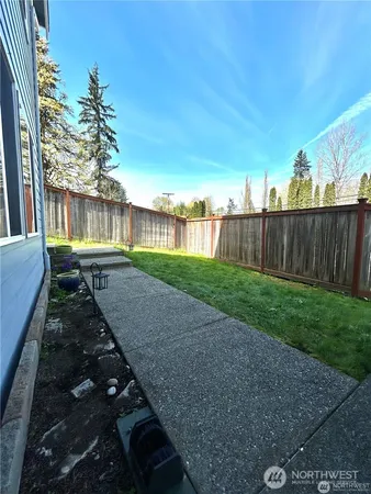 a view of backyard with green space