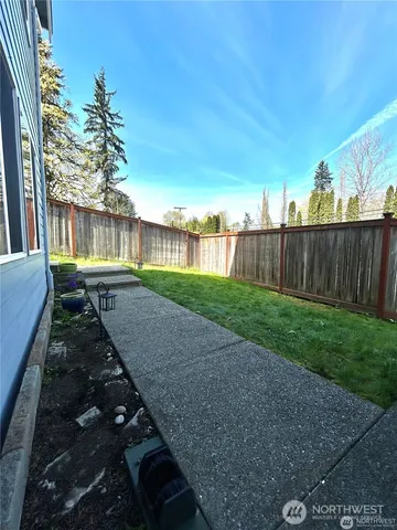 a view of backyard with green space