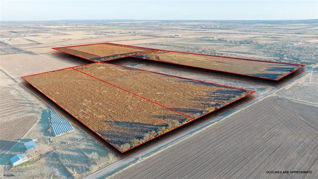 a view of wooden floor and a floor to ceiling window
