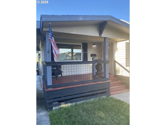 a view of staircase with a bench and a window