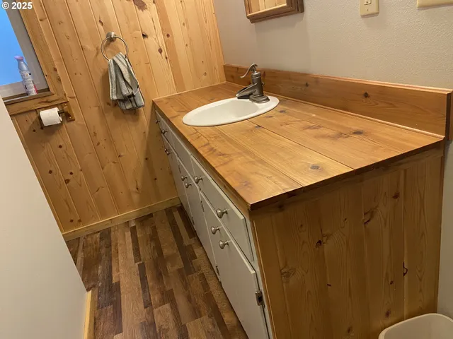a bathroom with a sink and mirror
