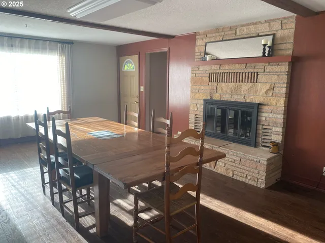 a dining room with furniture and window