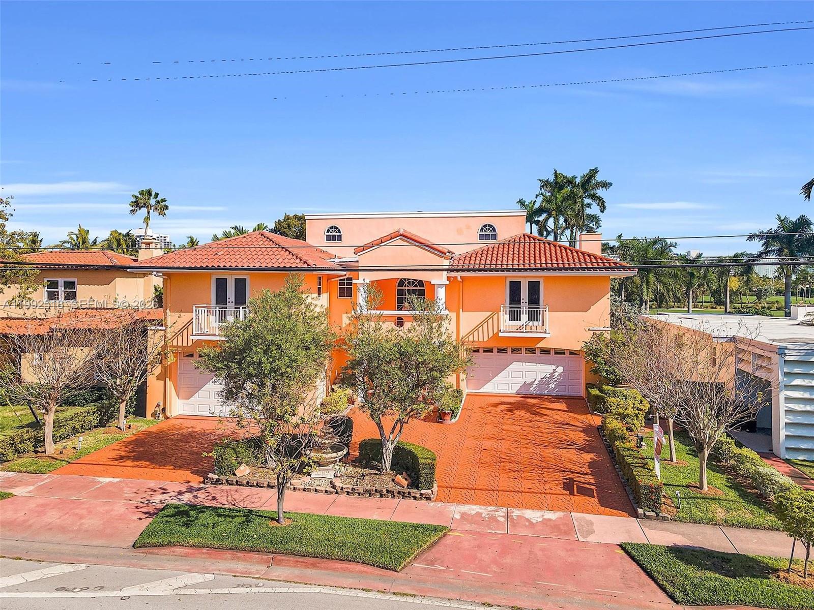 5309 Alton Road Miami Beach, FL 33140 - Photo 34 of 51 a front view of a house with a yard