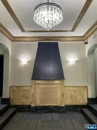 a view of room with wooden floor