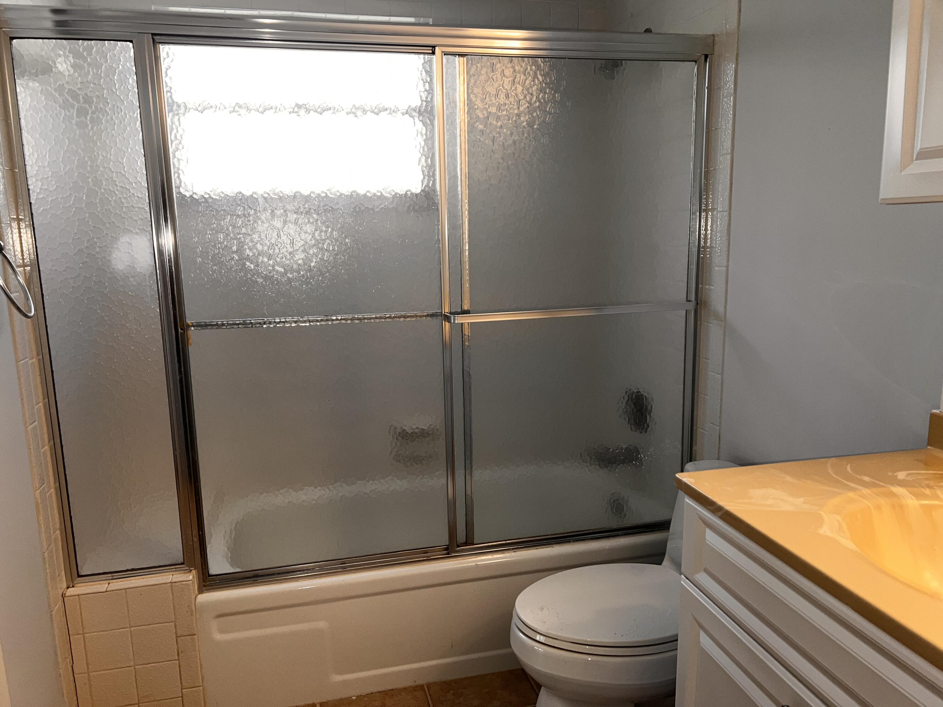 2403 Antigua Circle, Unit O2 Coconut Creek, FL 33066 - Photo 23 of 31 a bathroom with a shower and a toilet