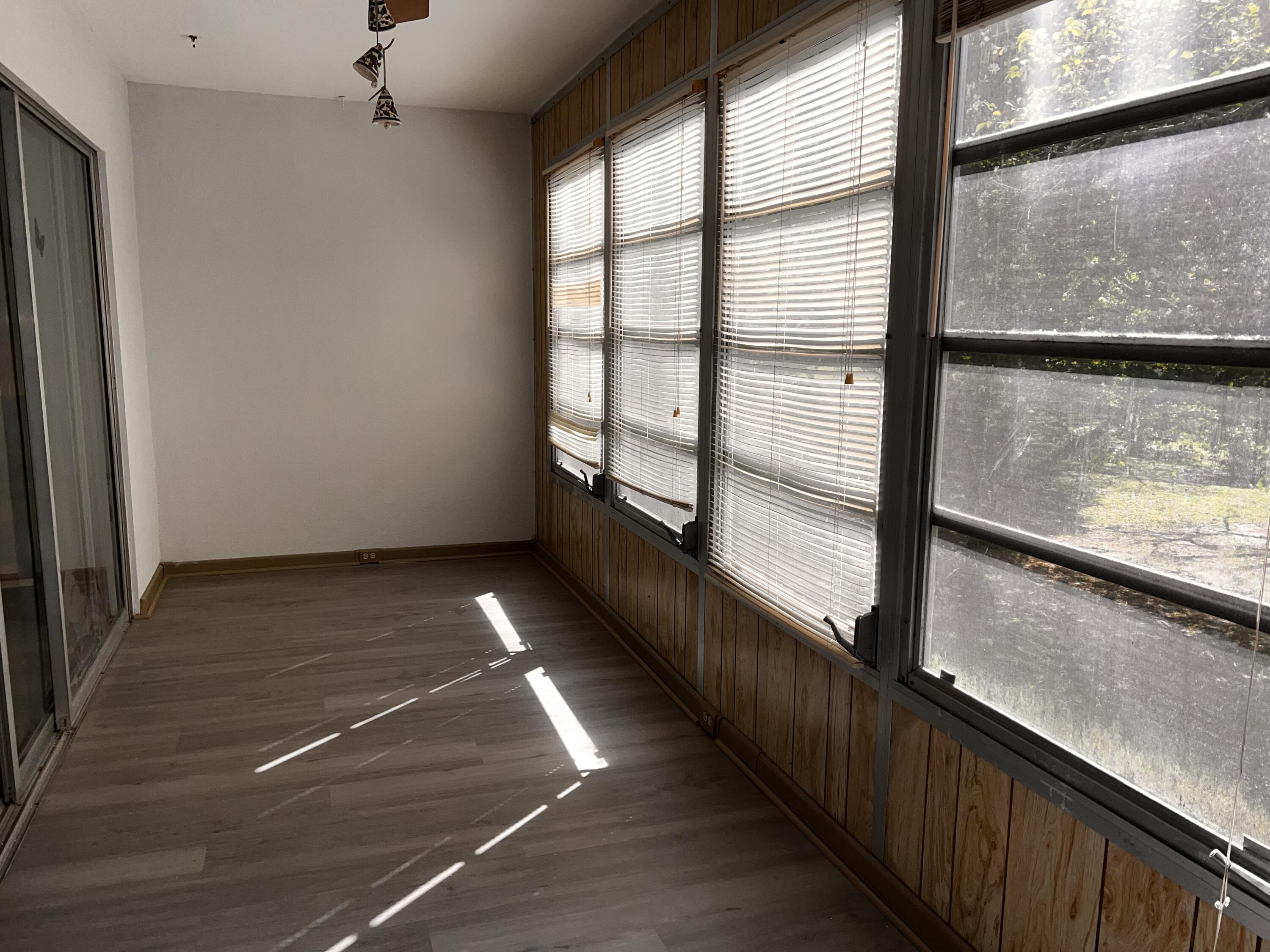2403 Antigua Circle, Unit O2 Coconut Creek, FL 33066 - Photo 24 of 31 a view of a balcony with floor to ceiling windows with an outdoor space