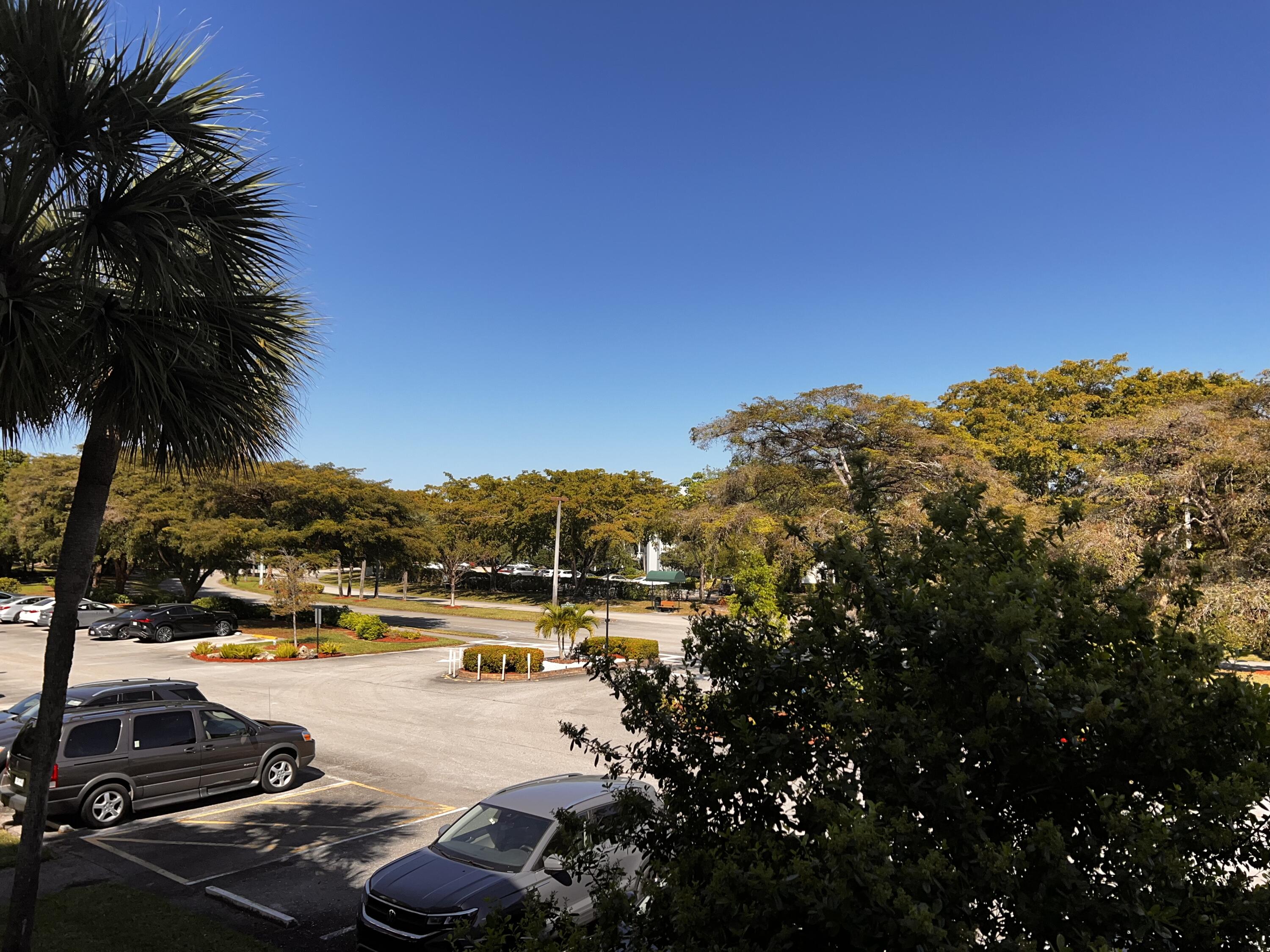2403 Antigua Circle, Unit O2 Coconut Creek, FL 33066 - Photo 30 of 31 a view of a lake with houses