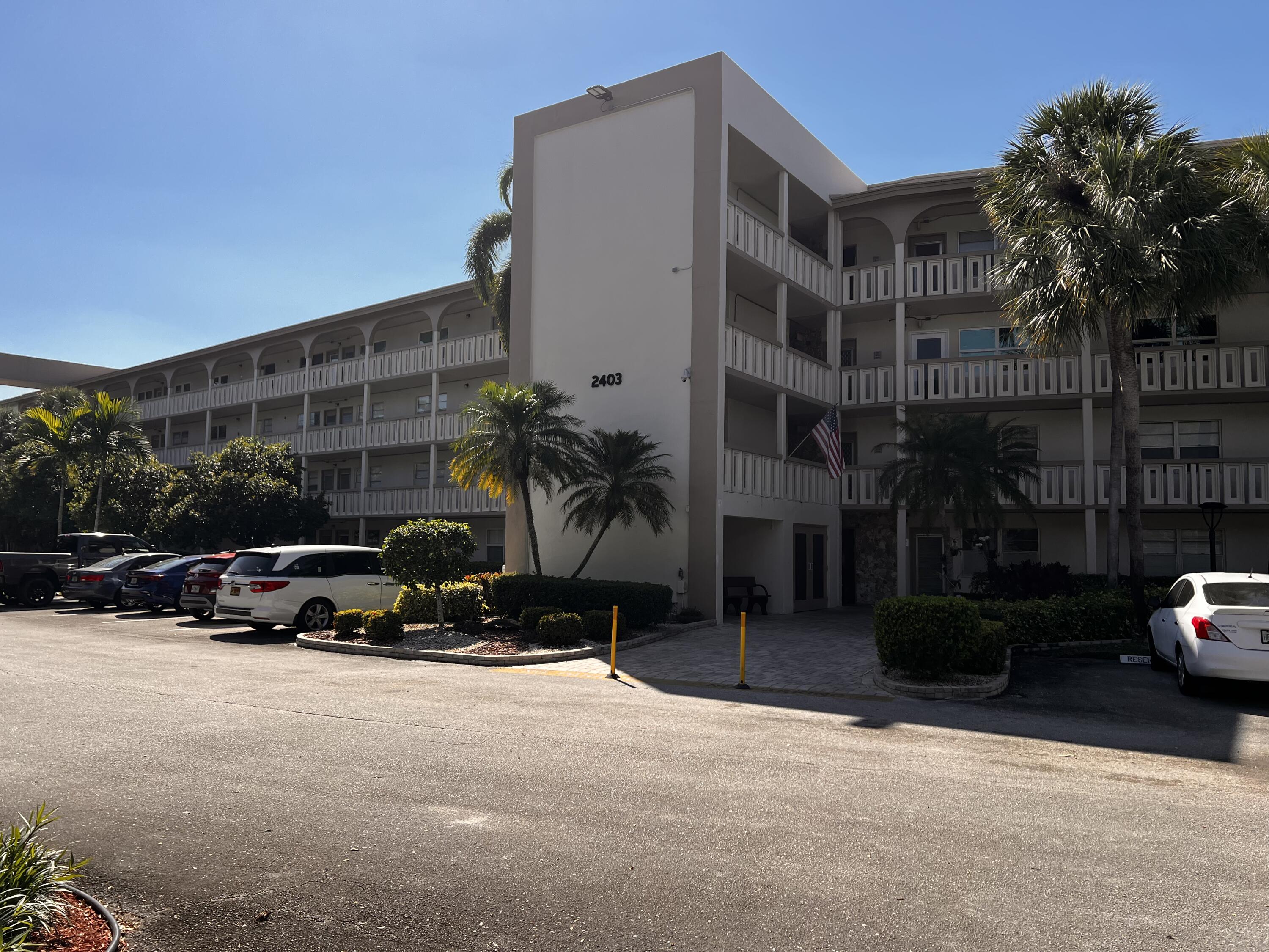 2403 Antigua Circle, Unit O2 Coconut Creek, FL 33066 - Photo 31 of 31 a car parked in front of a building