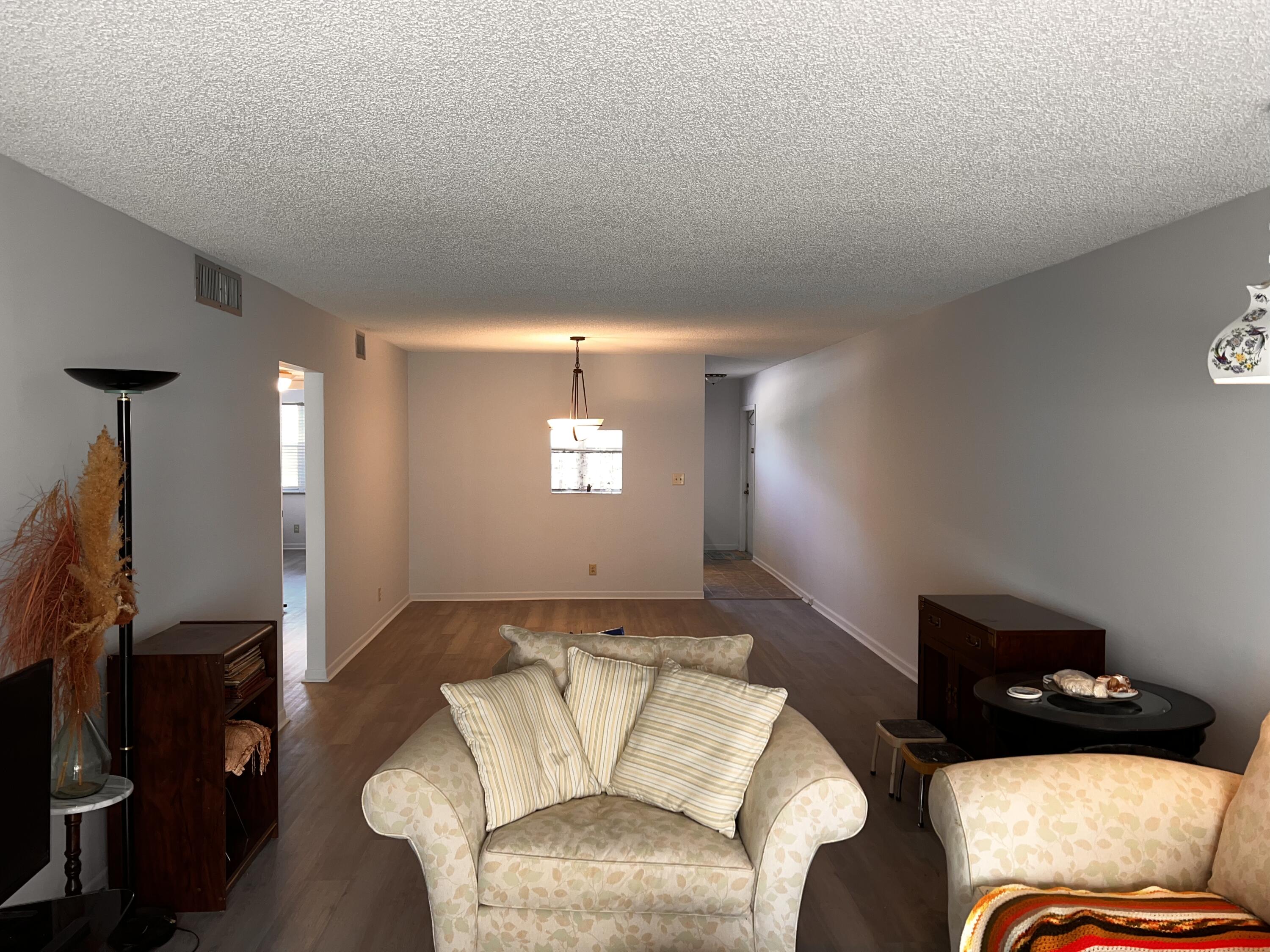 2403 Antigua Circle, Unit O2 Coconut Creek, FL 33066 - Photo 9 of 31 a living room with furniture and a window