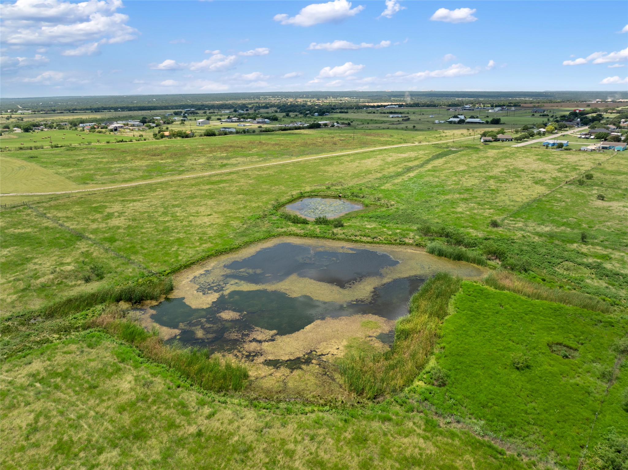 1775 County Road 305 Jarrell, TX 76537 - Photo 8 of 11 View of property location featuring rural landscape and a large body of water