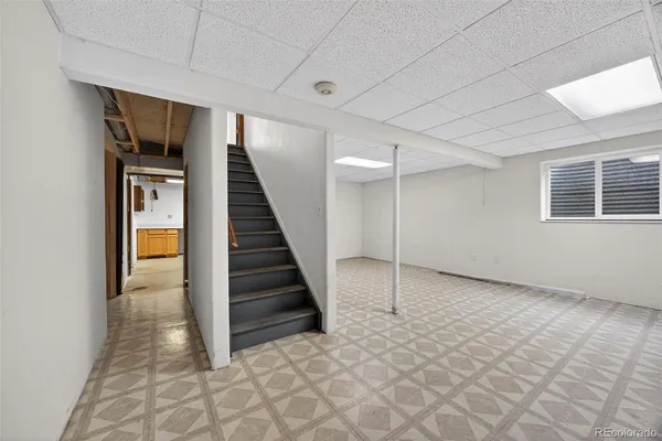a view of a livingroom with stairs