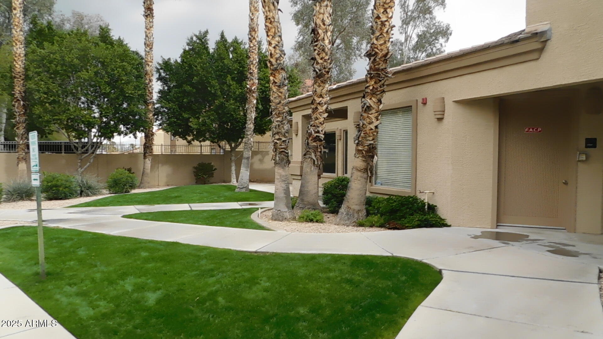 920 East Devonshire Avenue, Unit 4020 Phoenix, AZ 85014 - Photo 9 of 12 a view of a house with a yard