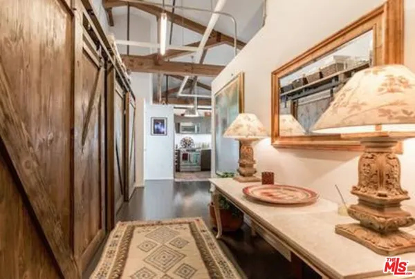 a kitchen with a sink a refrigerator and a stove