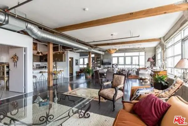 a living room with furniture and a table