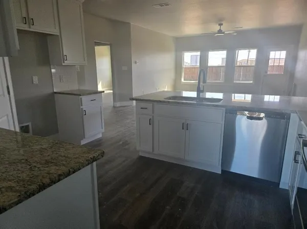 a view of a bathroom with dual sinks
