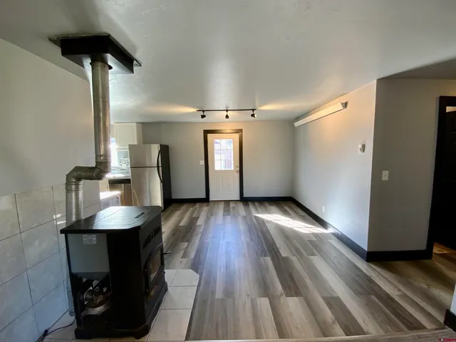 a view of a livingroom with furniture and wooden floor