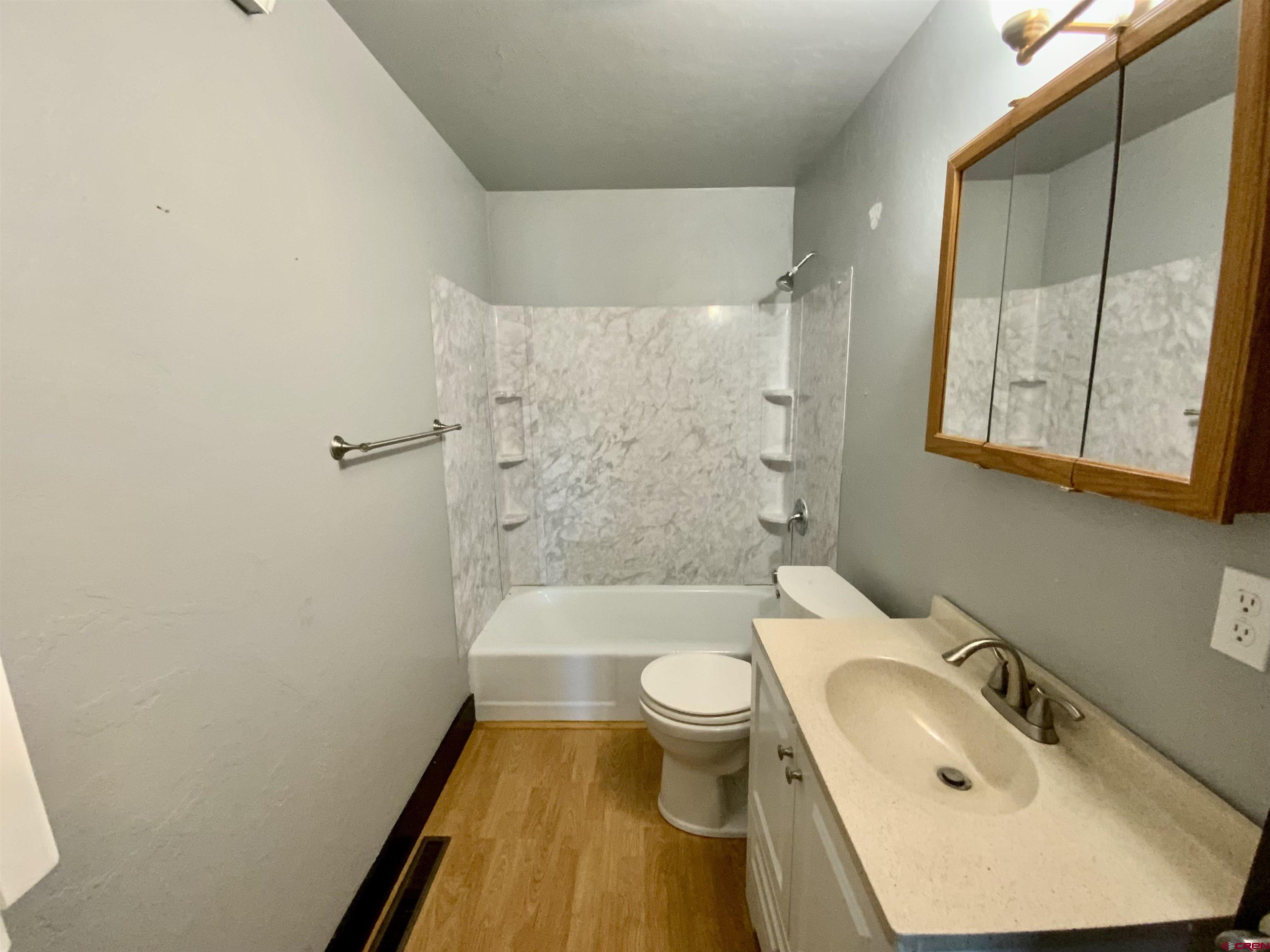 1511 West Tomichi Avenue Gunnison, CO 81230 - Photo 15 of 20 a bathroom with a sink toilet and shower