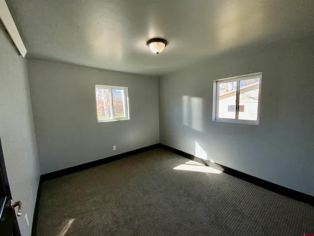 an empty room with closet and entertaining space