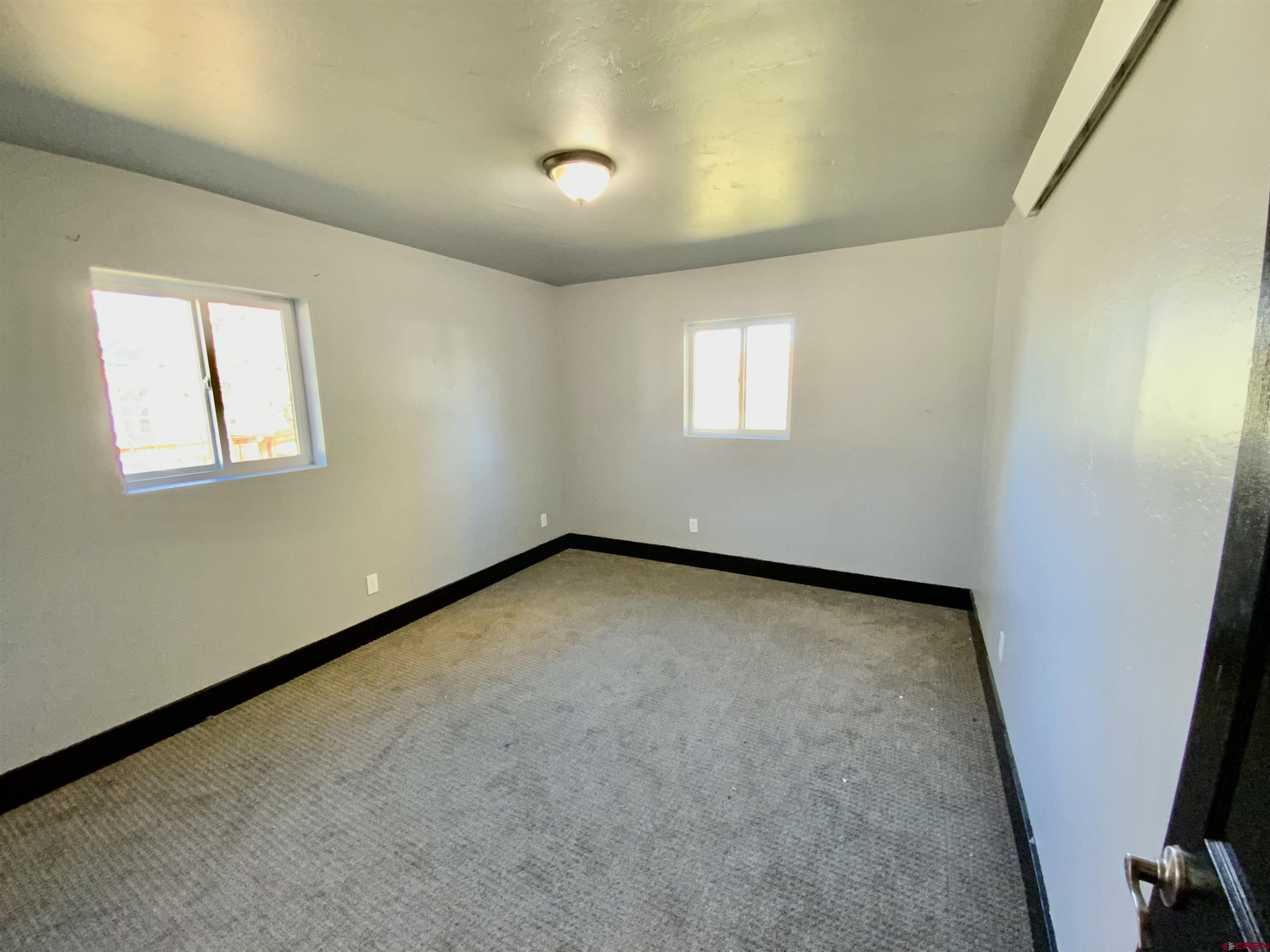 1511 West Tomichi Avenue Gunnison, CO 81230 - Photo 19 of 20 an empty room with windows