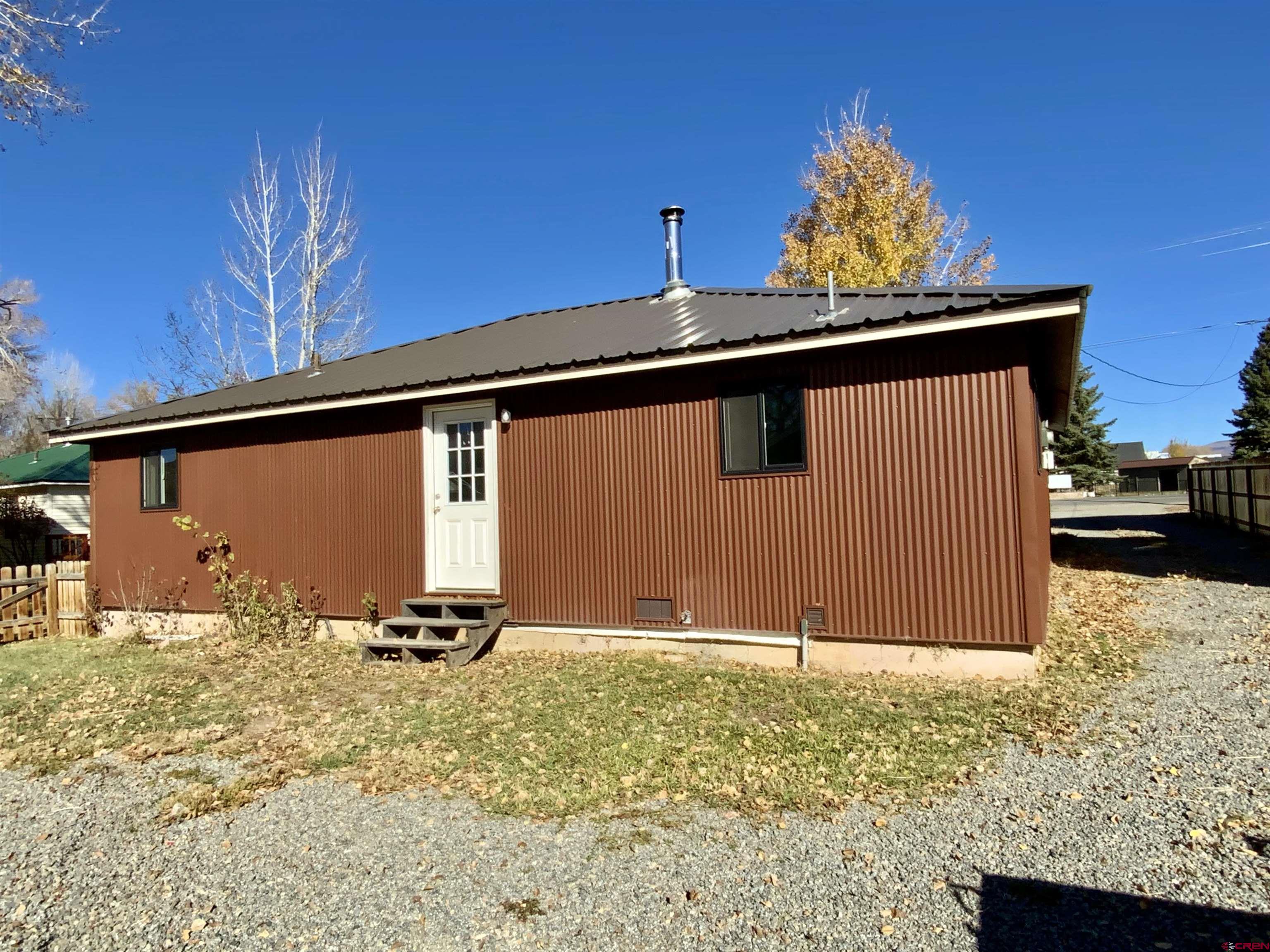 1511 West Tomichi Avenue Gunnison, CO 81230 - Photo 2 of 20 a view of a backyard