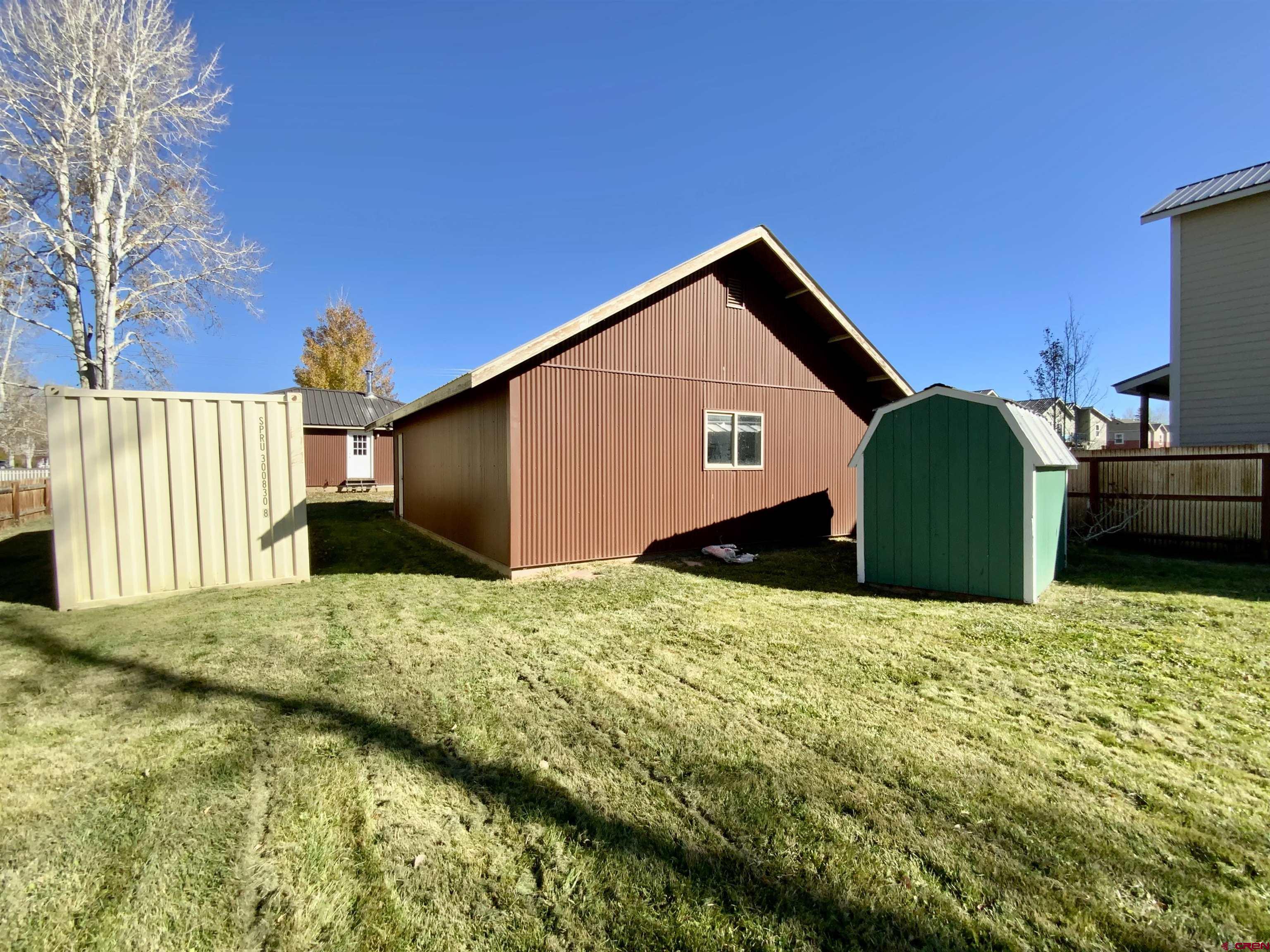1511 West Tomichi Avenue Gunnison, CO 81230 - Photo 3 of 20 a backyard of a house with a garage