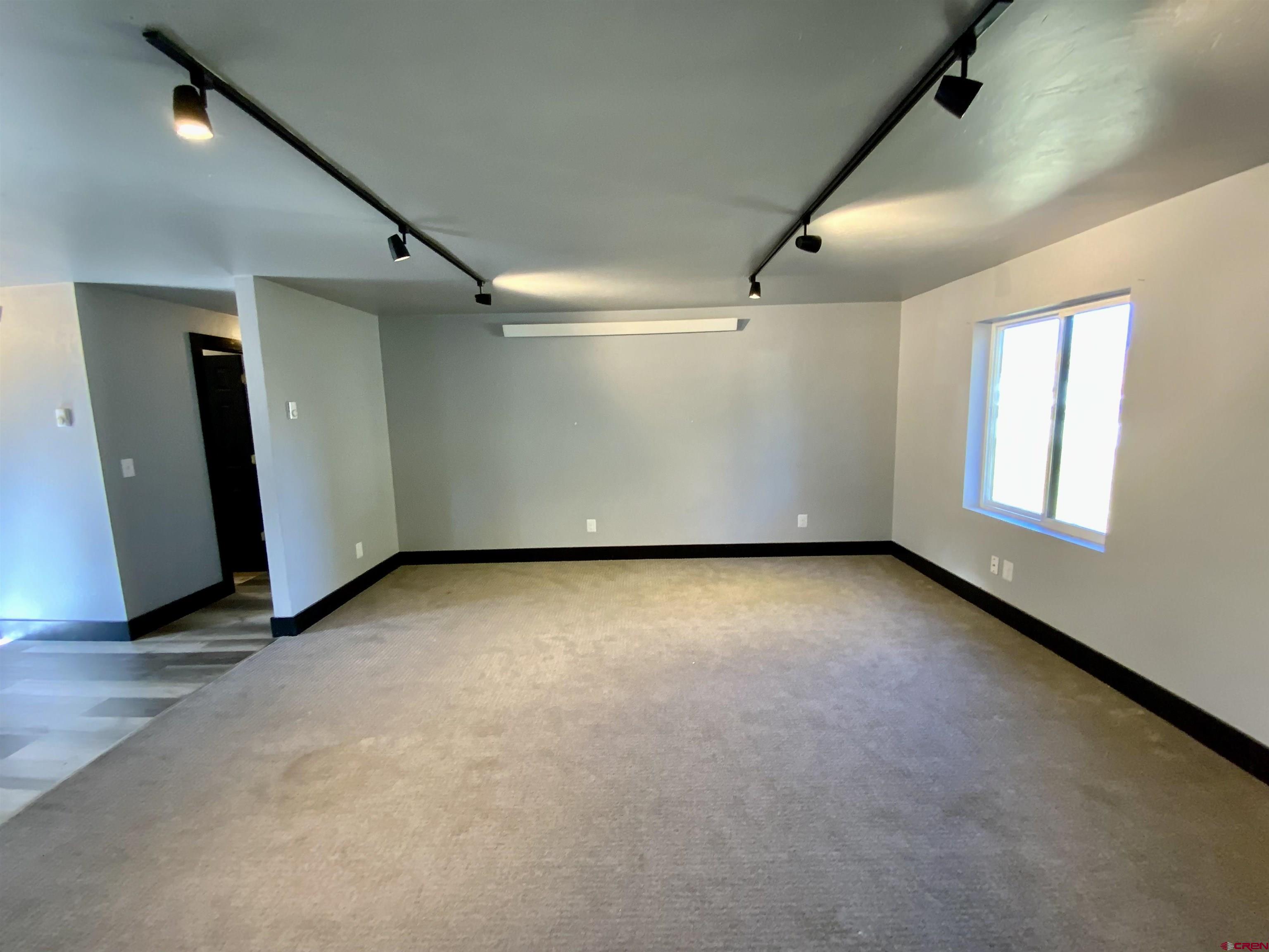 1511 West Tomichi Avenue Gunnison, CO 81230 - Photo 10 of 20 an empty room with windows